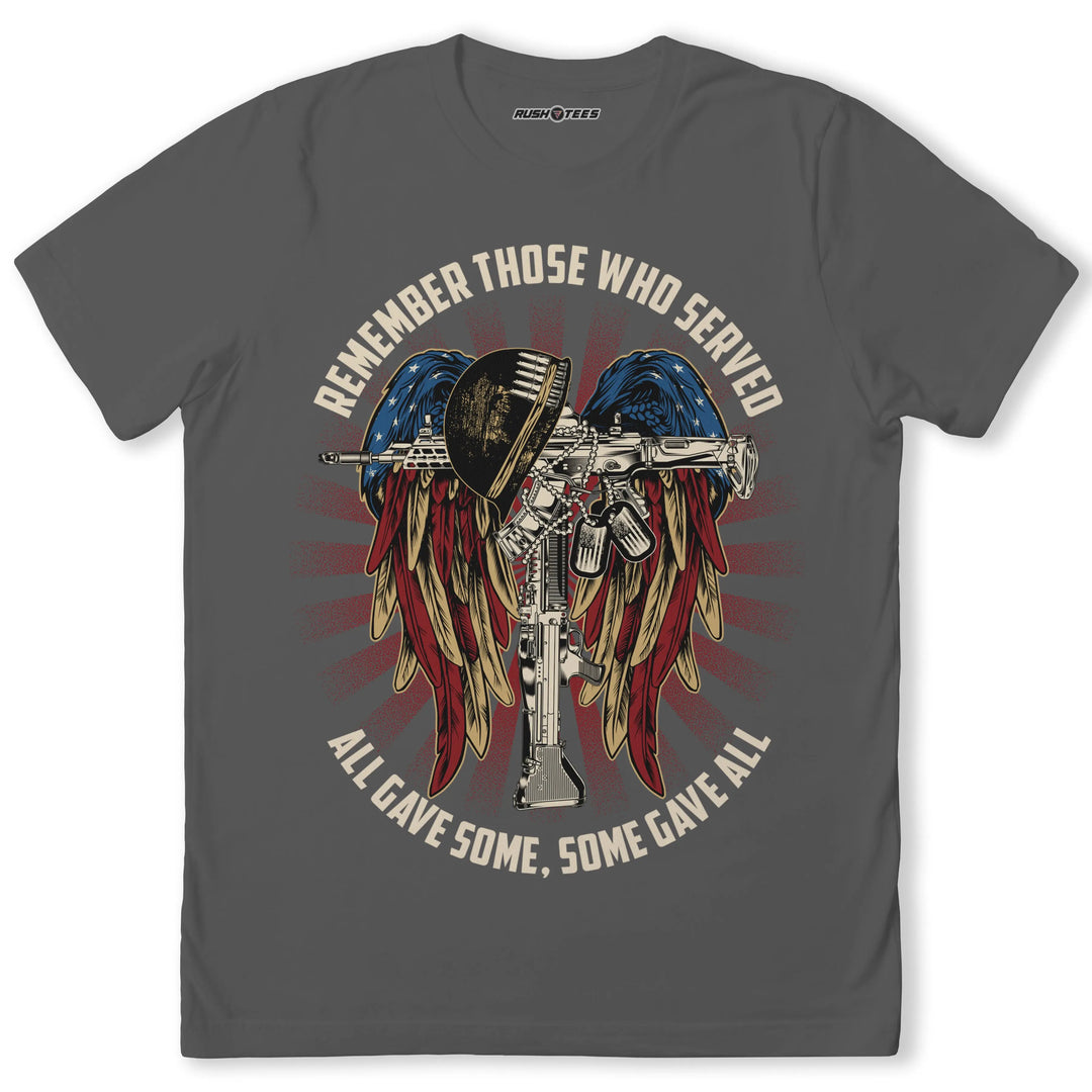 Veteran tribute t-shirt featuring a soldier's helmet and rifle with wings in patriotic colors, honoring those who served.