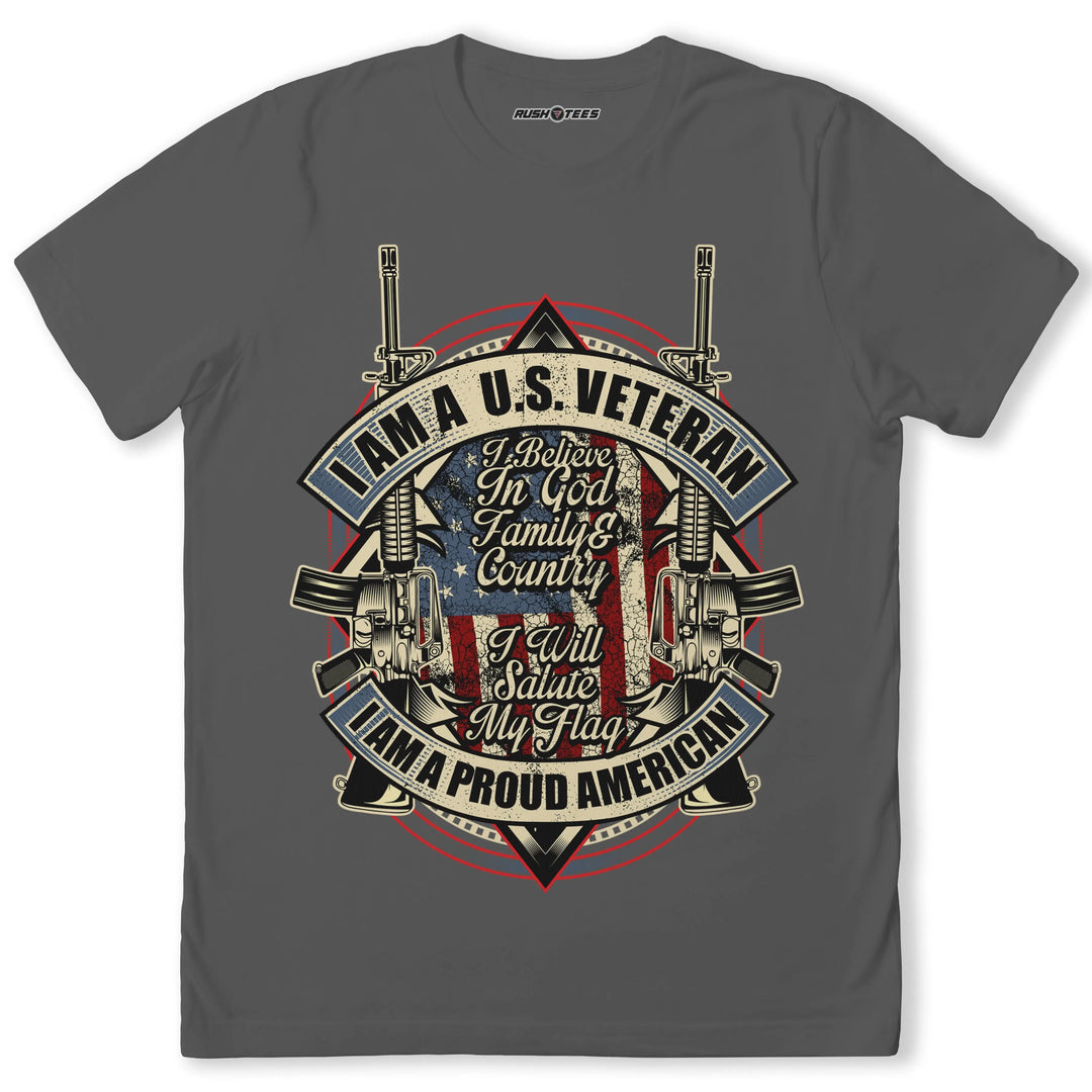 U.S. Veteran Proud American T-shirt featuring American flag, crossed rifles, and patriotic slogan. Comfortable cotton material.