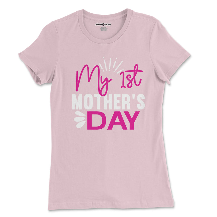 Pastel pink Mother's Day t-shirt for new moms featuring bold 'My 1st Mother's Day' graphic.