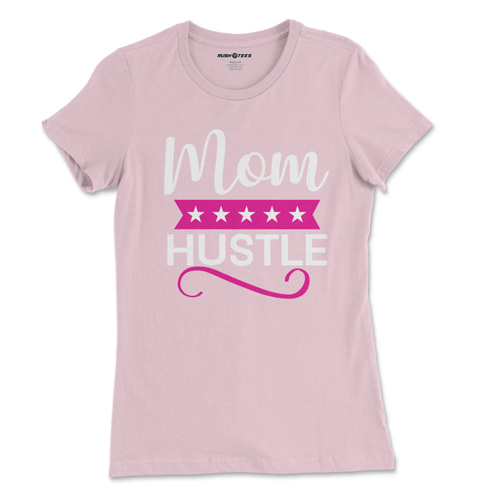 Mom Hustle pastel pink t-shirt with bold lettering, perfect for busy moms and a great Mother’s Day gift.