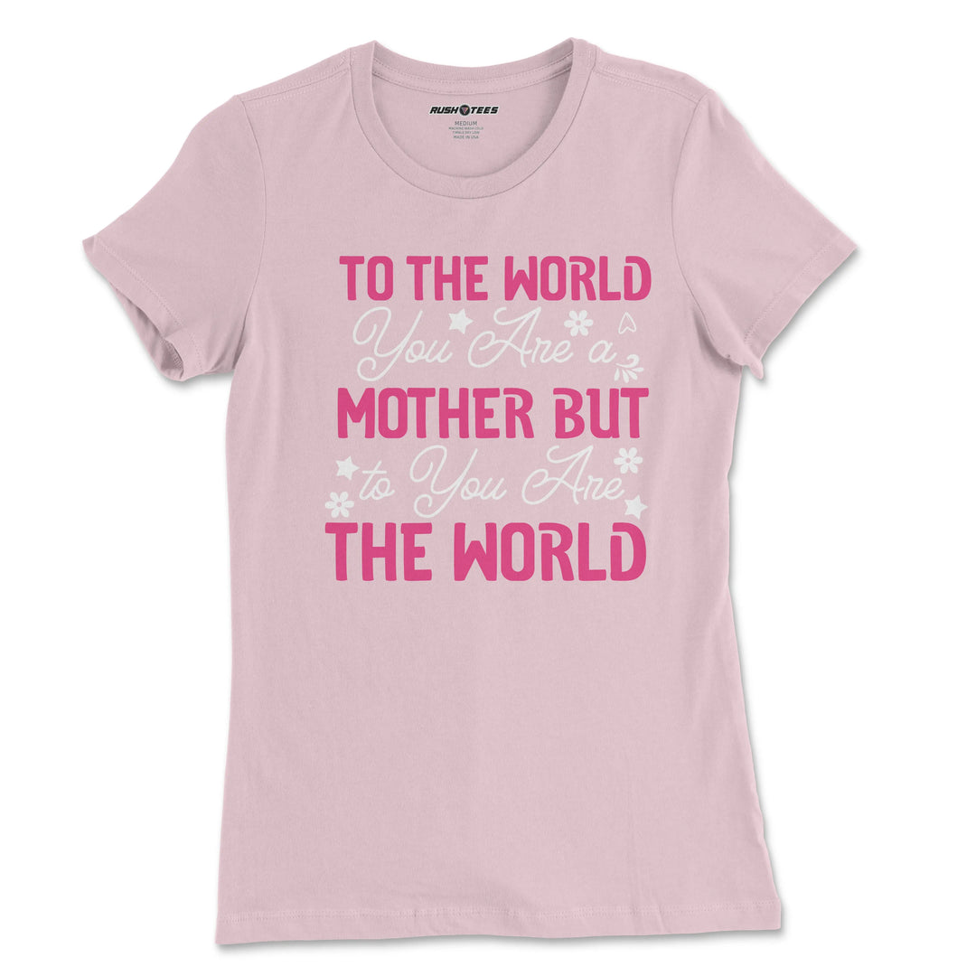 Pastel pink Mother's Day t-shirt with floral design featuring the quote 'To The World You Are A Mother But To You Are The World'.