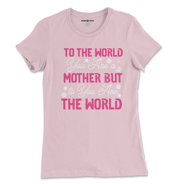 Pastel pink Mother's Day t-shirt with floral design featuring the quote 'To The World You Are A Mother But To You Are The World'.