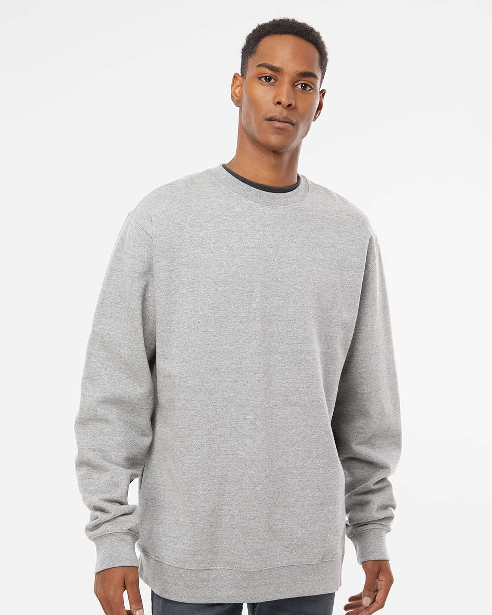 Unisex gray crewneck sweatshirt on model, showcasing soft feel and customizable design options for personalized apparel.