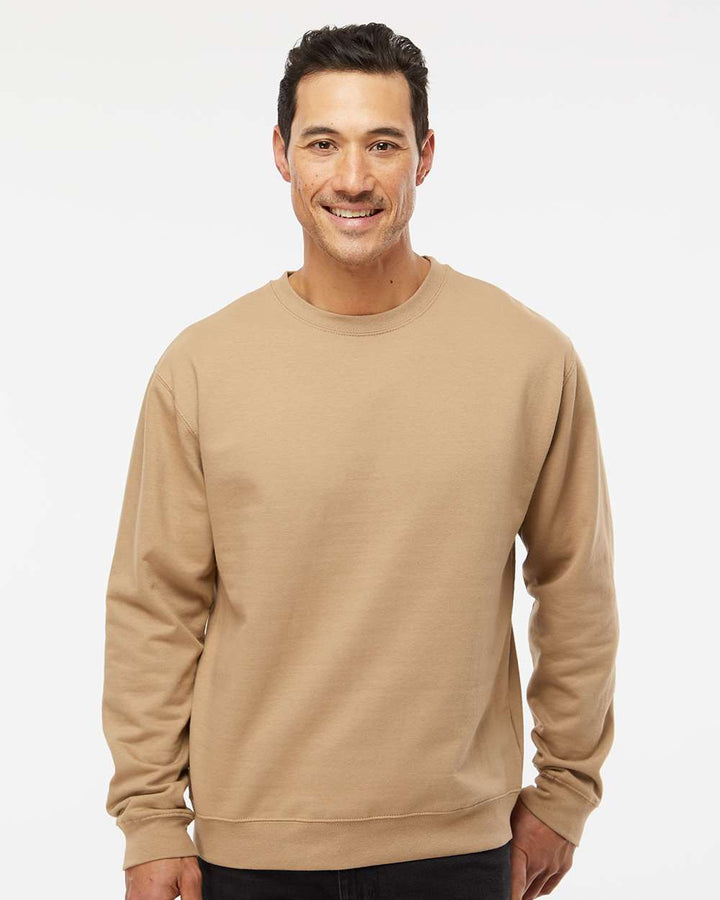 Unisex crewneck sweatshirt in soft beige color worn by a smiling man, ideal for custom apparel design.